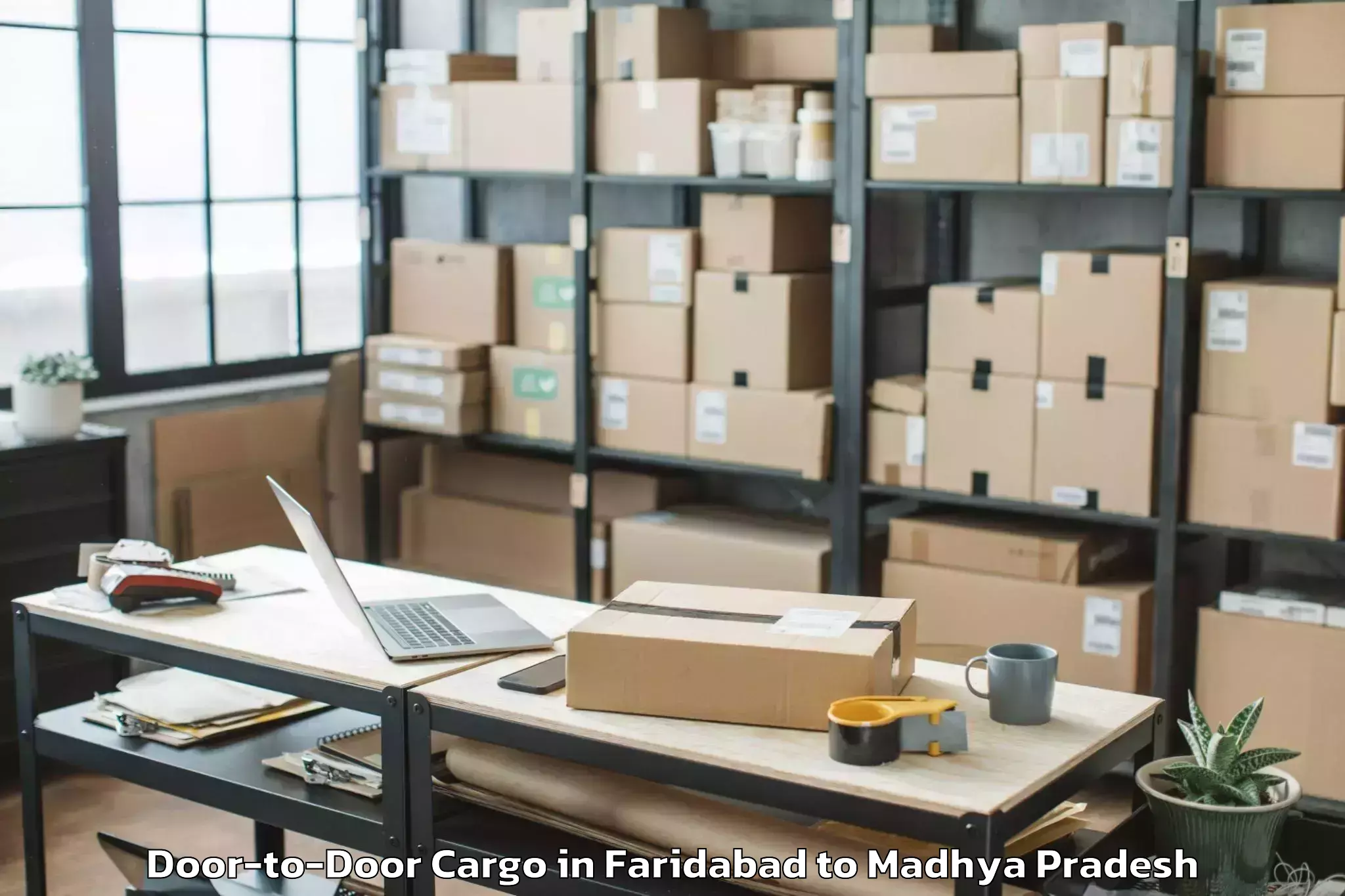 Top Faridabad to Kolaras Door To Door Cargo Available